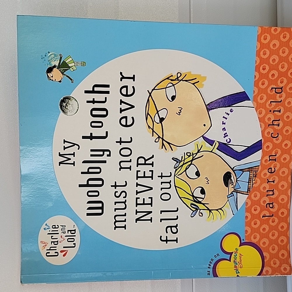 My wobbly tooth must not ever never fall out by Lauren child